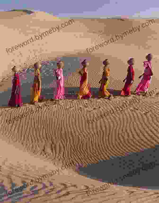 A Woman In A Flowing Dress Walks Across A Vast Desert Landscape Sahara Unveiled: A Journey Across The Desert (Vintage Departures)