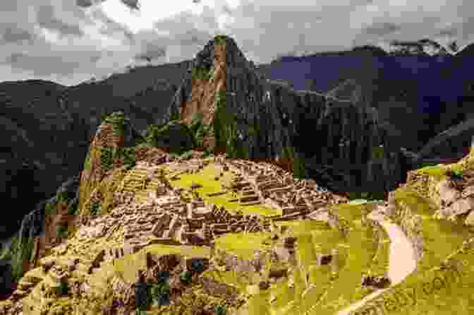 Aerial View Of The Lost City Of The Incas, Machu Picchu, Perched Amidst Lush Green Mountains And Terraces Cloud Road: A Journey Through The Inca Heartland